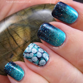 aquatic nail art look using sponge gradient and glitter top coat, with an octopus tentacle accent nail created with a dotting tool