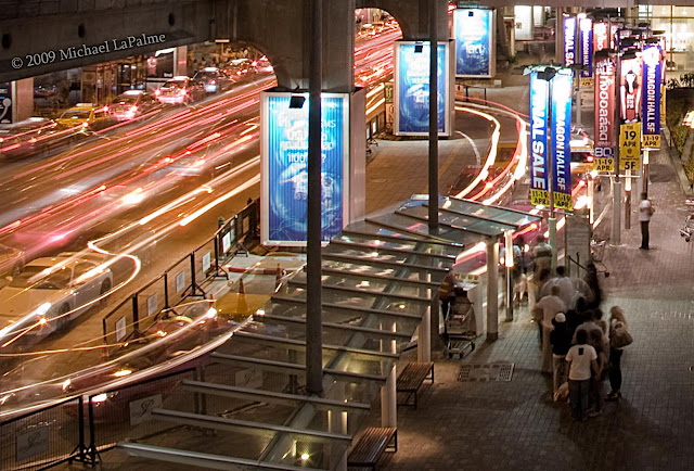 Shoppers existing Siam Paragon wait for a taxi near Siam Square / National Stadium   © Michael LaPalme 