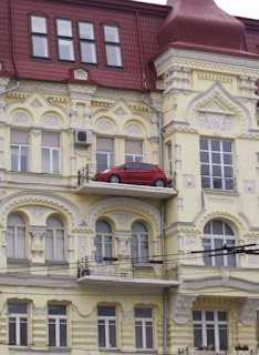 red car on a french chateau balcony