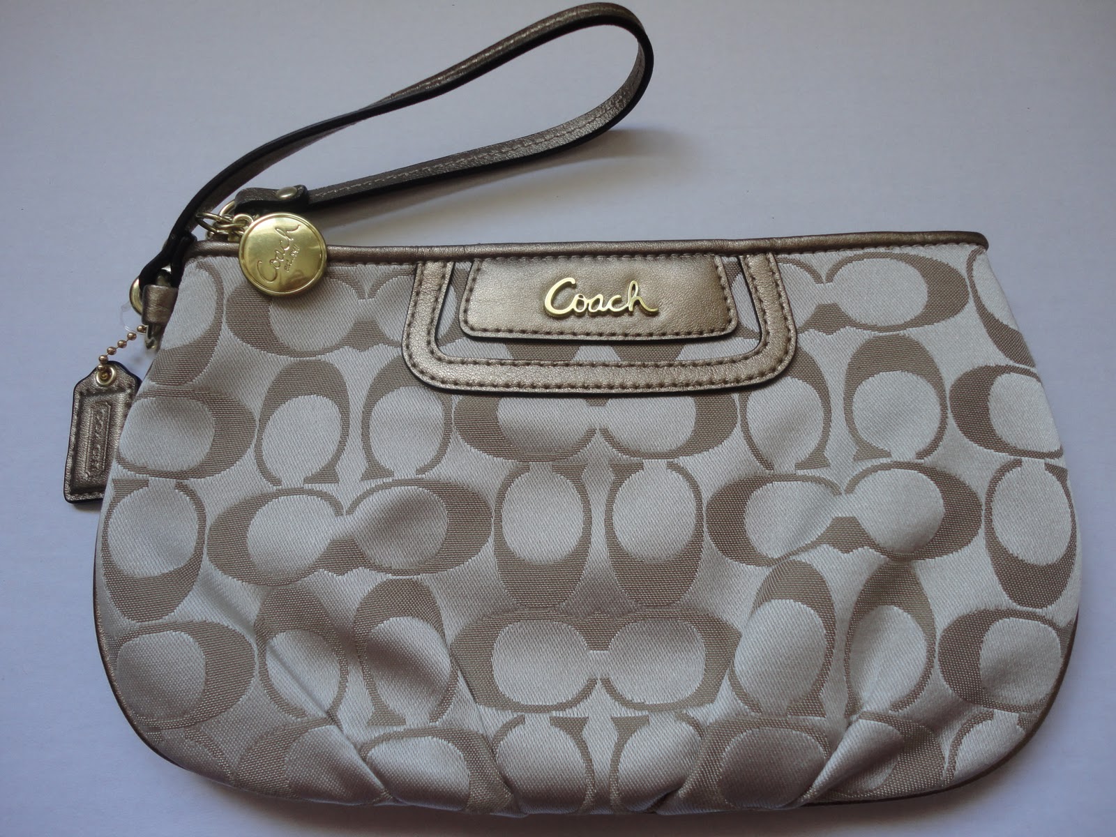 worth a girl's wait coach signature sateen large wristlet (khaki