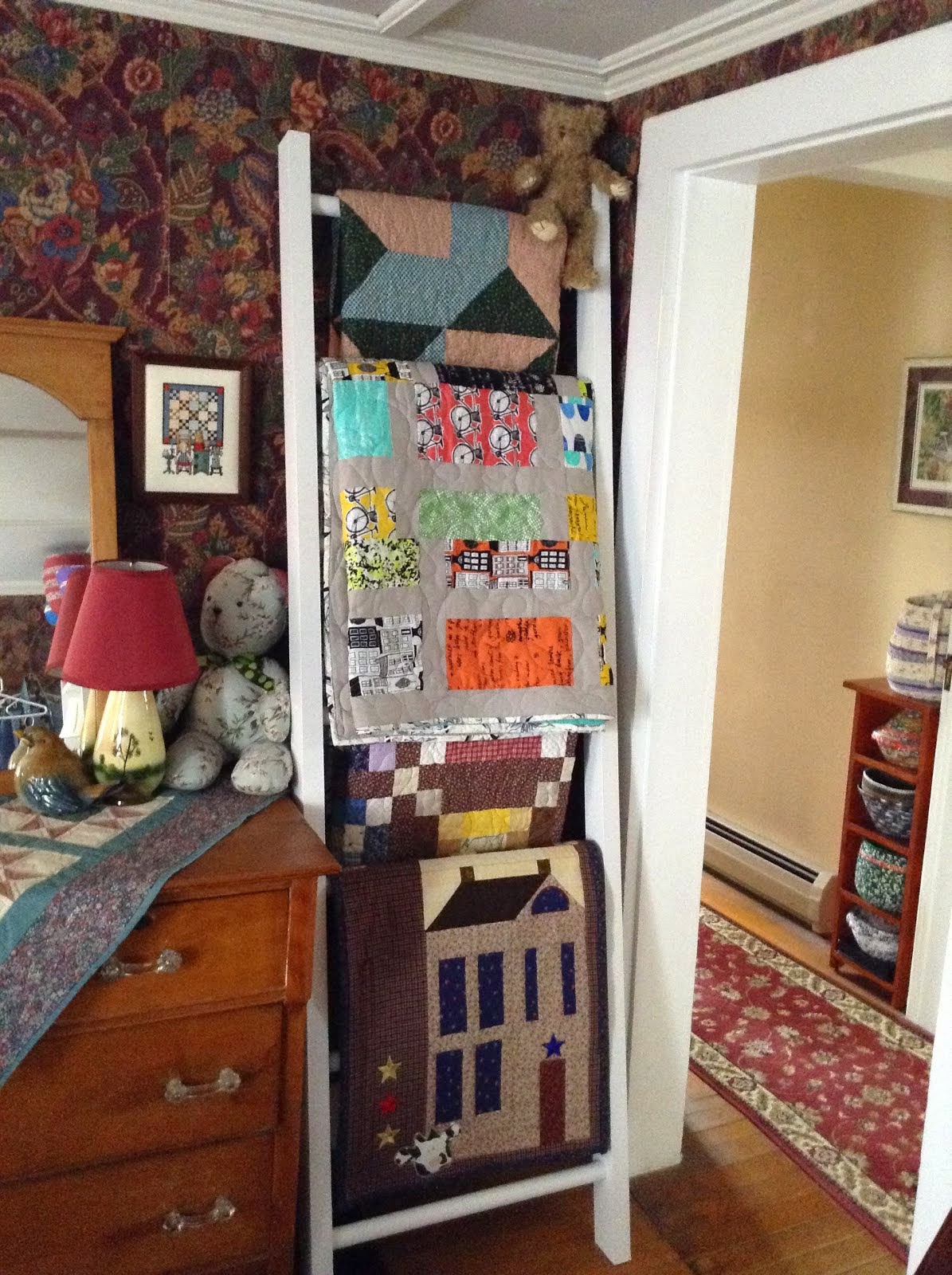 Quilt Ladder(so many quilts, had to climb wall!)
