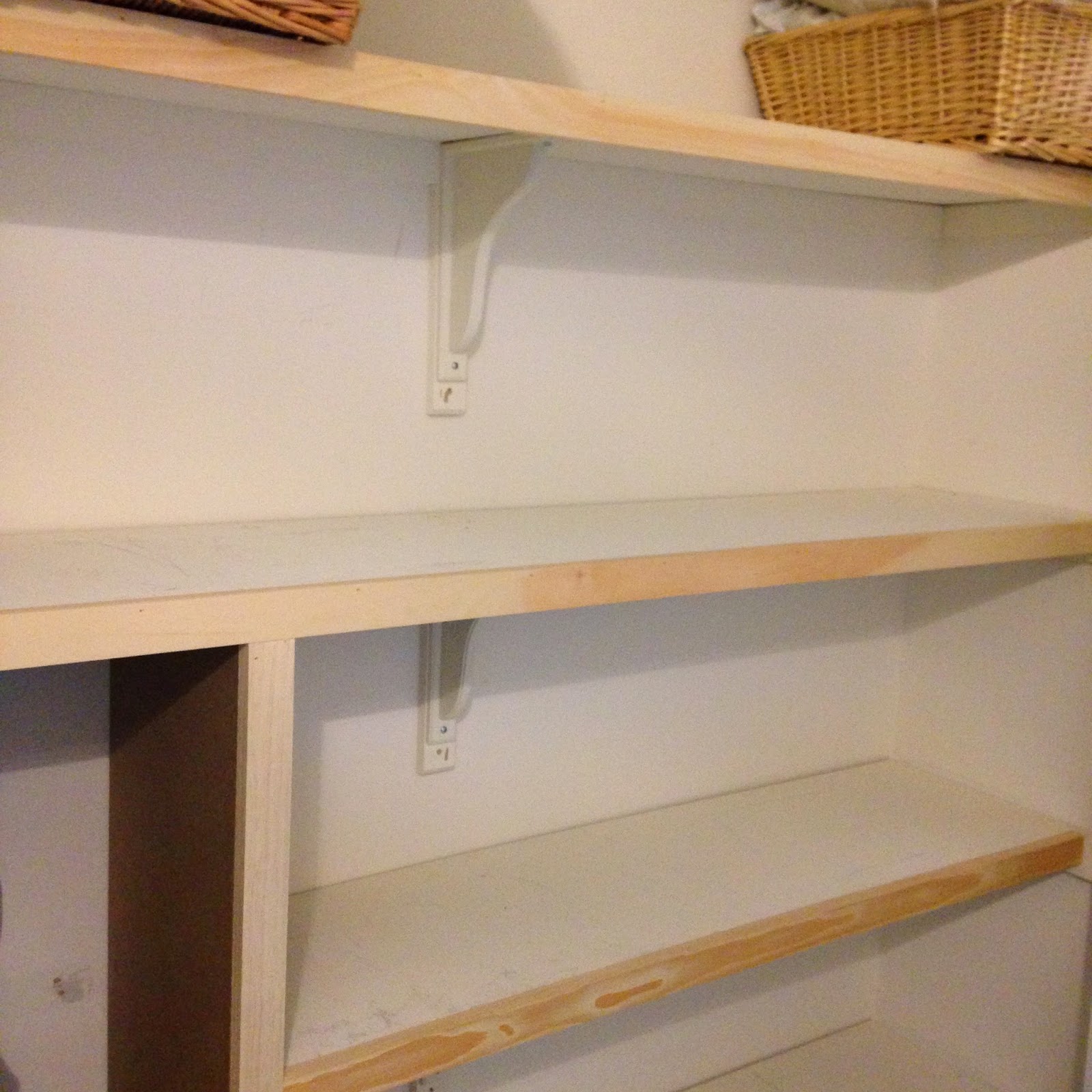 White Wood linen closet organization