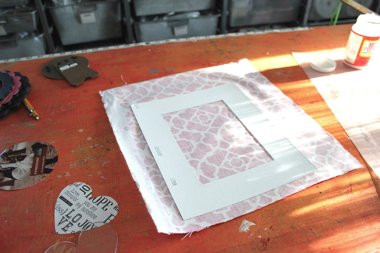 Cathie Filian DIY How to cover a photo mat with fabric and Mod Podge.