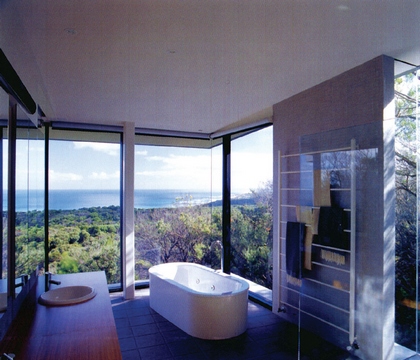 [Bathroom with large windows and scenic view outside]