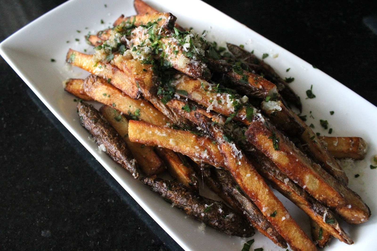 Milo Gales Roasted garlic fries with brown butter & Parmesan cheese