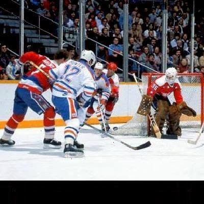 Vs. Edmonton: Rod Langway, ready to deflect Wayne Gretzky's pass; Al Jensen hugs the post 