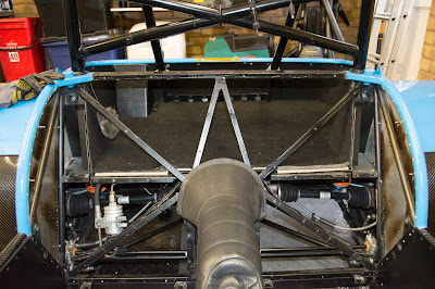 Rear bulkhead panel removed, revealing the structure of most of the rear of the car