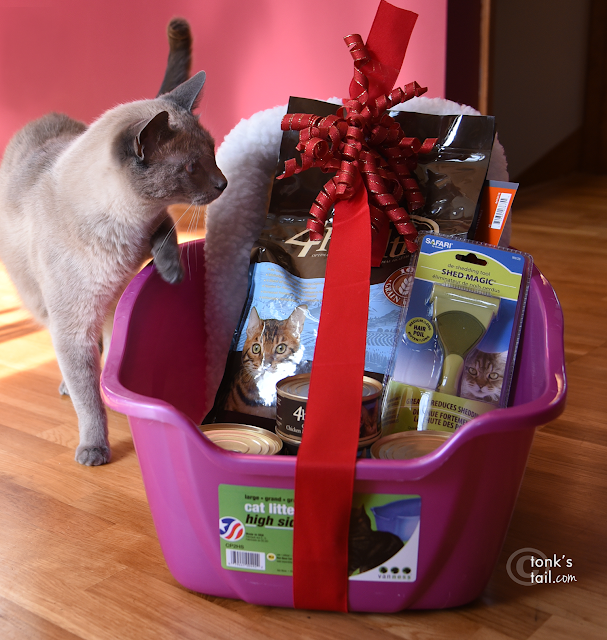 Maxie gives the Great Plains SPCA gift bundle his sniff of approval