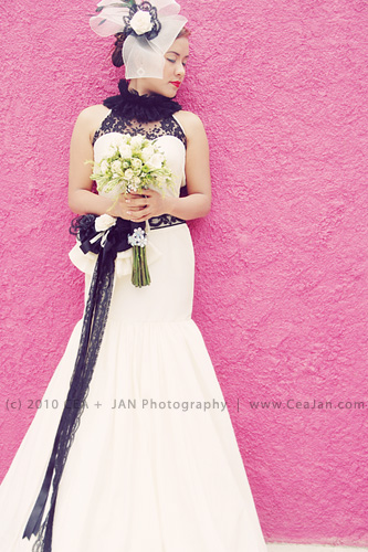 Chic mermaid style wedding dress with black lace detail designed by Doddie