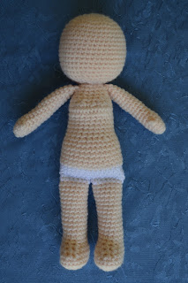 Body of the doll before adding face and hair.  The stitches are flesh coloured except for white stitches for the underpants.