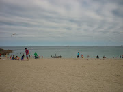 One of those timeless seaside scenes: people busy having fun.