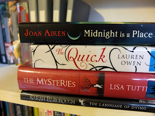 A stack containing the books listed above