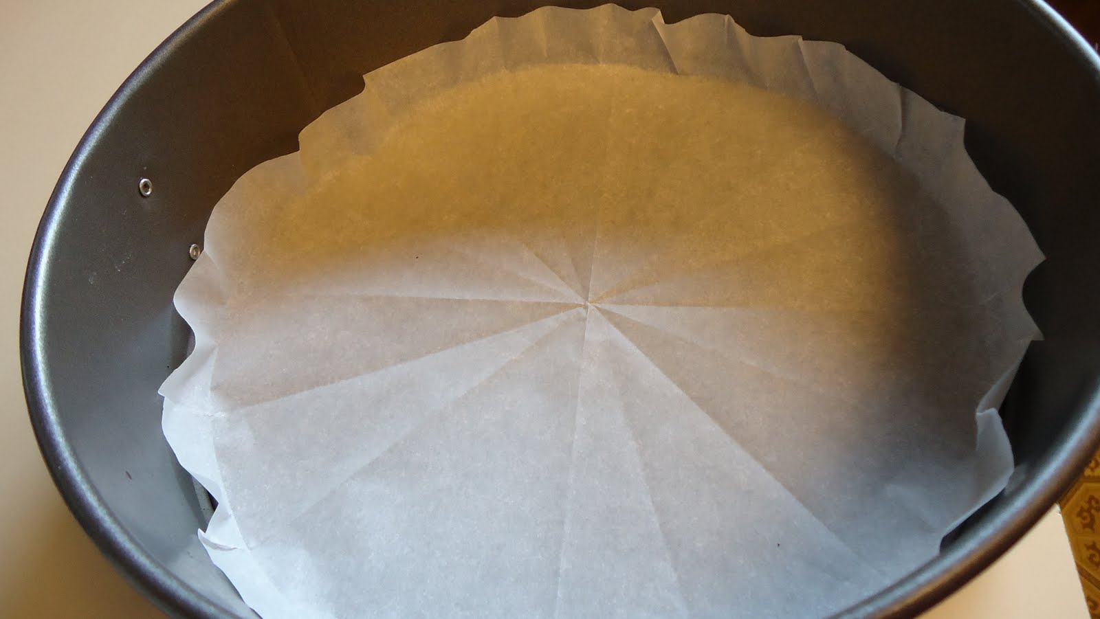 Unique Party Food to Go Cutting parchment paper to fit a round pan