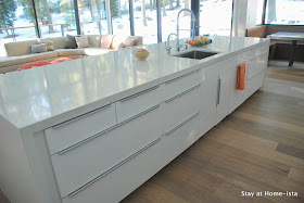 Ikea kitchen customized with a waterfall quartz countertop