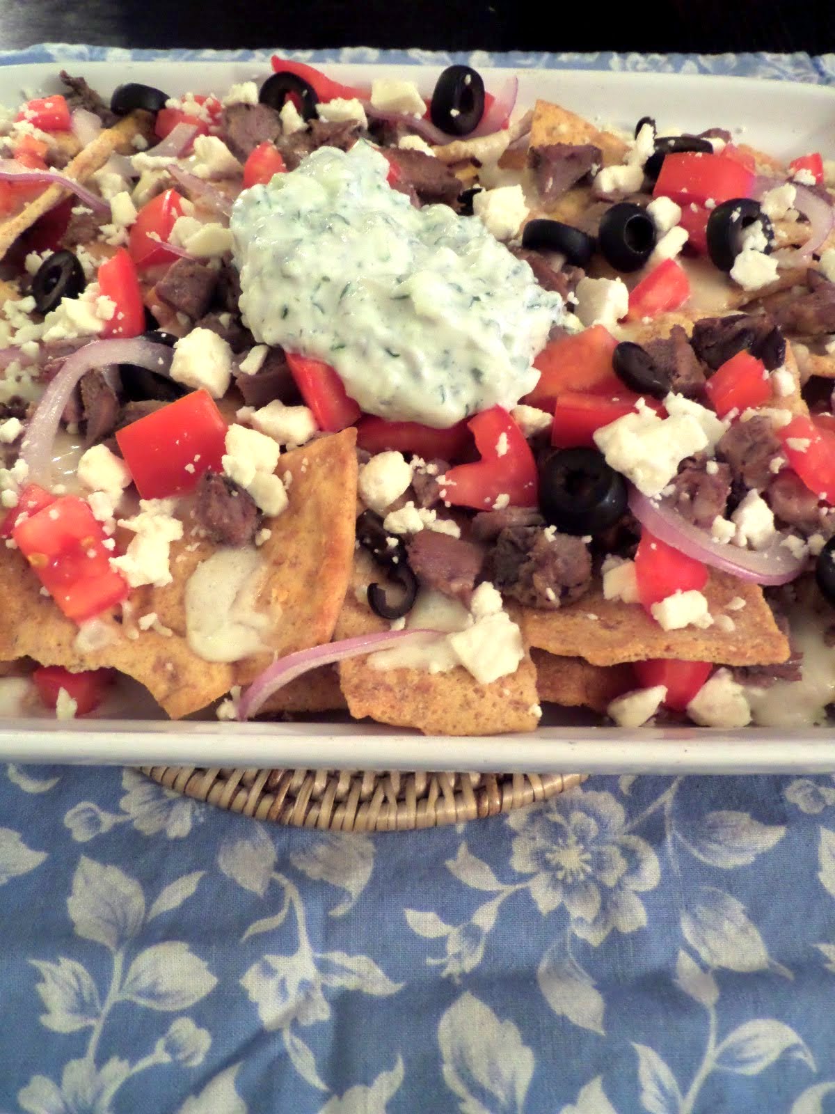 Greek Nachos:  Nachos with a Greek twist.  Pita chips topped with lamb, olives, tomatoes, and feta.