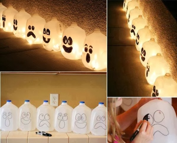 this is an form of halloween decorations collect the plastic cans draw the halloween masks on them by using markers then hang the bulbs inside them