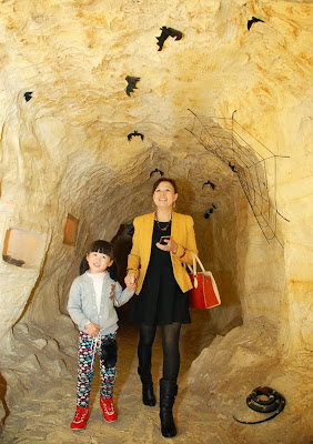 Visitors taking interest in the model of a traditional cave at Pakistan Museum of Natural History