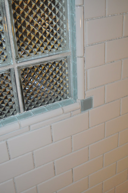 bathroom, reno, subway tile, sea glass tile, glass tile, white grout, grout, glass block window, 