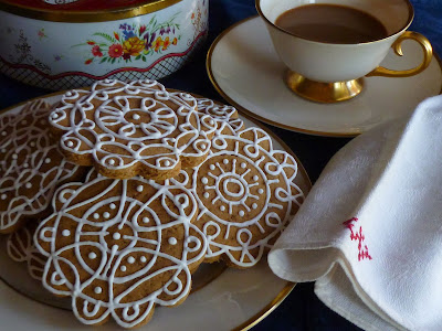 decorated gingerbread cookies, coffee, red flower tin