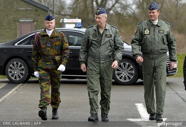 King Philippe of Belgium, escorted by Base Commander Georges Franchomme, arrives for a visit to the Beauvechain Air Base.