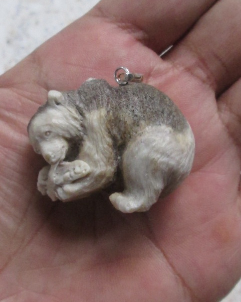Carved Bear Bone Pendants in Antler Carved Bear Bone Pendants in Antler