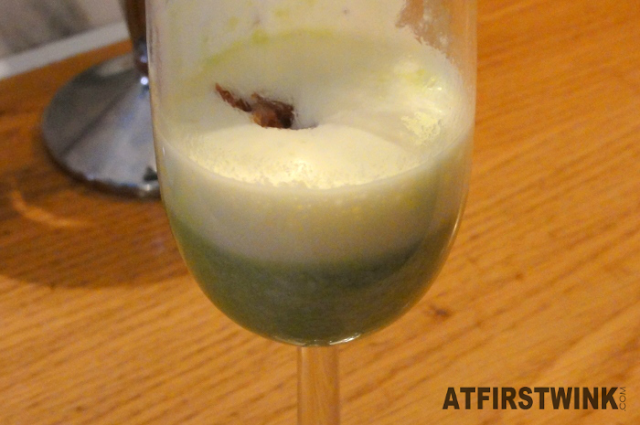 green pea cream foam soup with bacon snips (appetiser)