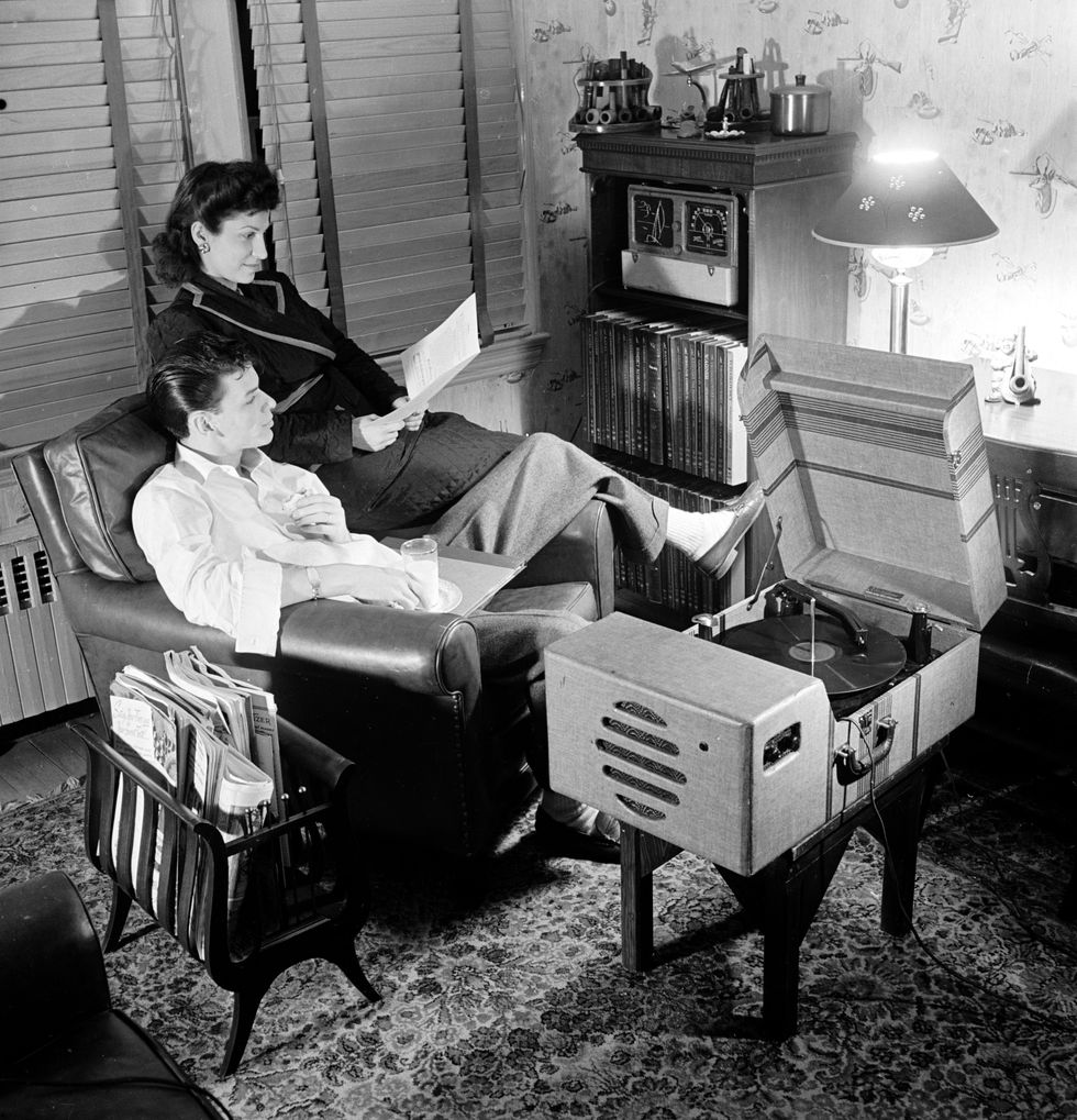 Frank Sinatra and his wife Nancy Sinatra listening to music in their home in 1943