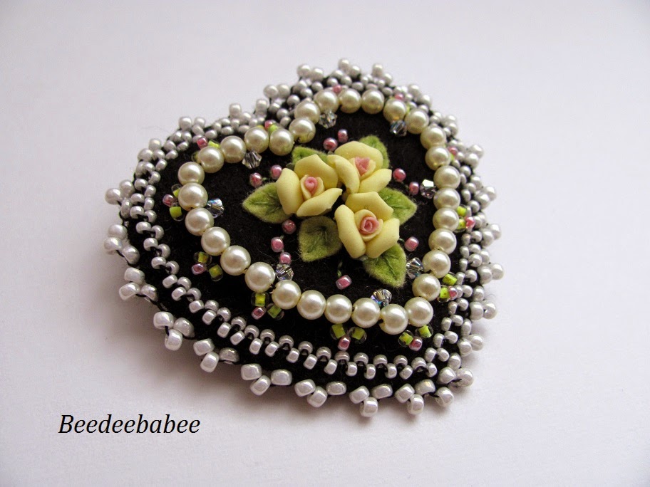 black heart pin with yellow roses