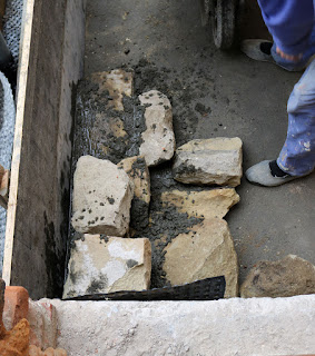Stones being used to build up the base for the steps Stones being used to build up the base for the steps