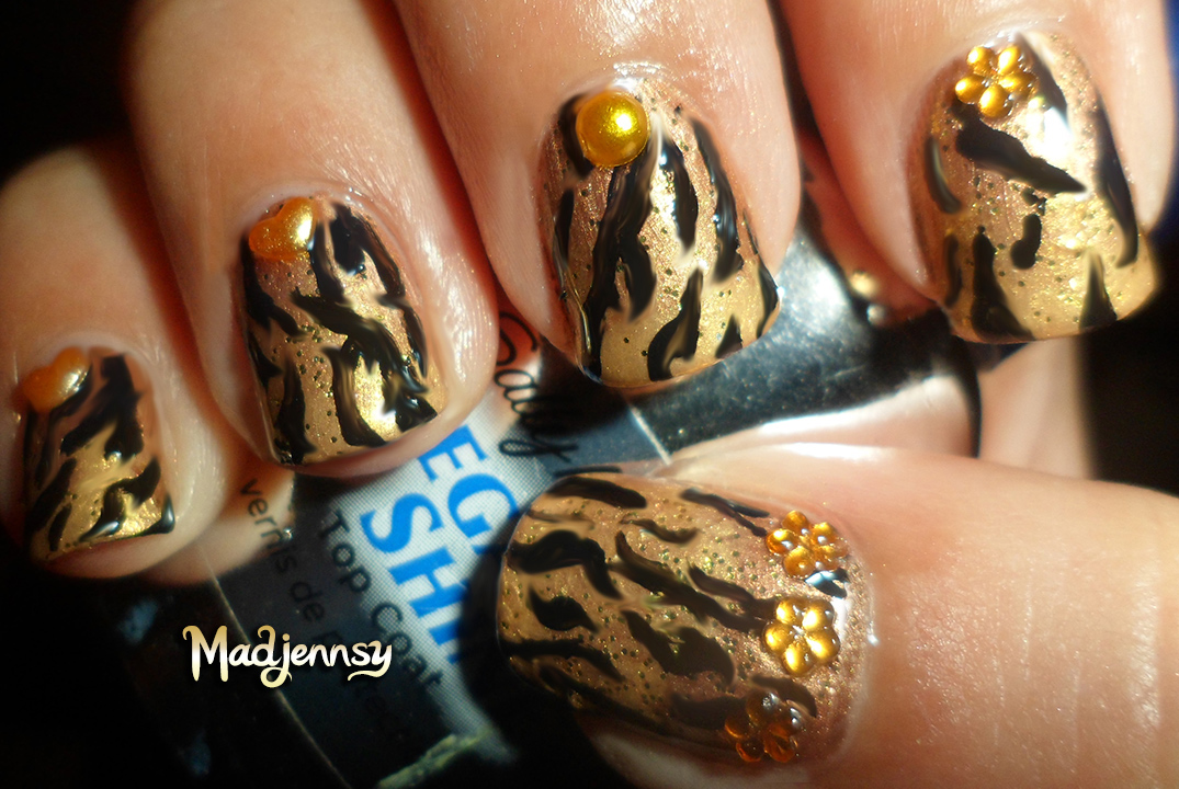 3. Step by Step Guide to Tiger Print Nails - wide 2