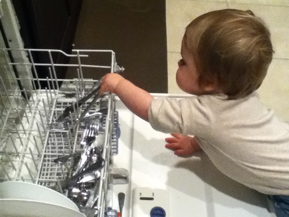 Little Guy Adventures Stacking the dishwasher.
