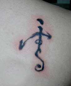 Chinese character tattoo on the shoulder