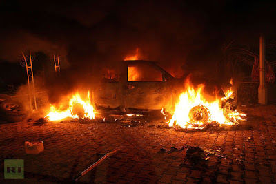 A vehicle and the surrounding area are engulfed in flames after it was set on fire inside the US consulate compound in Benghazi late on September 11, 2012.(AFP Photo / STR)