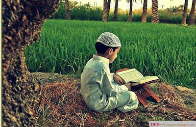 a-boy-recitation-Holy-Quraan-alone-beneath-tree