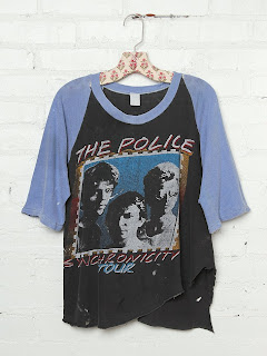 Vintage black and blue concert t-shirt with a graphic of The Police band