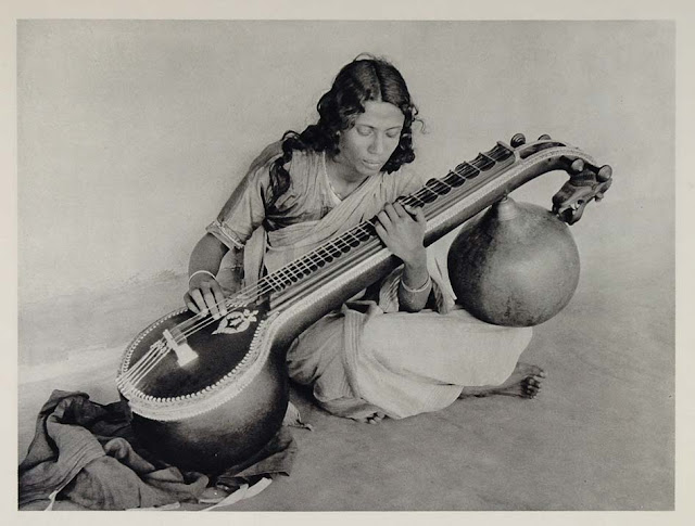A+Young+Bengali+Woman+Playing+a+Saraswati+veena+-+1928