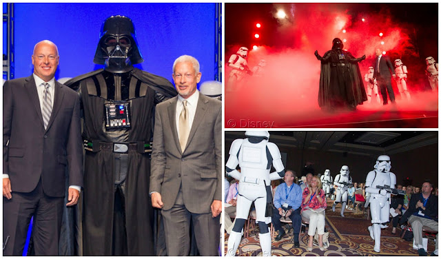 Disney Consumer Products President, Bob Chapek, left, and Lucasfilm Executive Vice President Howard Roffman pose with Darth Vader and 20 Stormtroopers as they take over the stage during a private Disney event at the Licensing Expo, Monday June 17, 2013 at the Mandalay Bay Convention Center in Las Vegas. This surprise grand finale, presented to more than 1,500 licensees, demonstrates a new era of merchandising potential for Disney Consumer Products’ robust franchise portfolio, which now includes the Star Wars franchise. (Photo by Eric Jamison/Invision for DisneyConsumer Products/AP Images)
