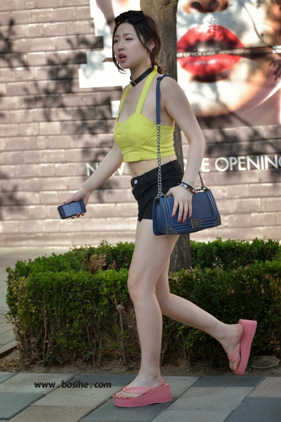 Asia Travel Photography: Navel exposed, shorts girl, Asian street