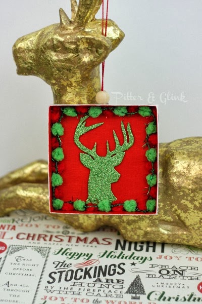 Create a Deer Silhouette Ornament from a recycled gift box using this tutorial from Pitter & Glink! #DIYOrnament #Christmascraft