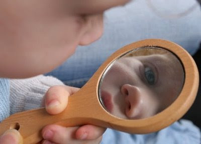 NAMC montessori sensitive periods missed opportunity toddler looking in mirror