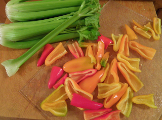 Celery and Multicolor Bell Peppers on Cutting Board