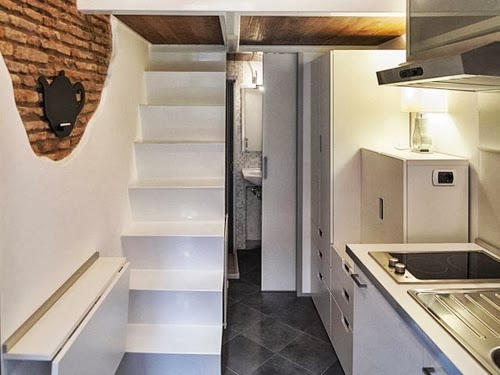 05-Kitchen-Dining-Stairs-Bed-and-Toilet-Door-Smallest-House-in-Italy-75-sq-Feet-7-m2-Italian-Architect-Marco-Pierazzi-www-designstack-co 