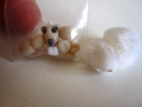 Close up of the components of a miniature 'Shirley Sheep: a New Zealand cuddly toy' kit.