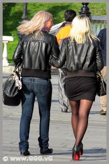 Girls in black leather jacket on the street 