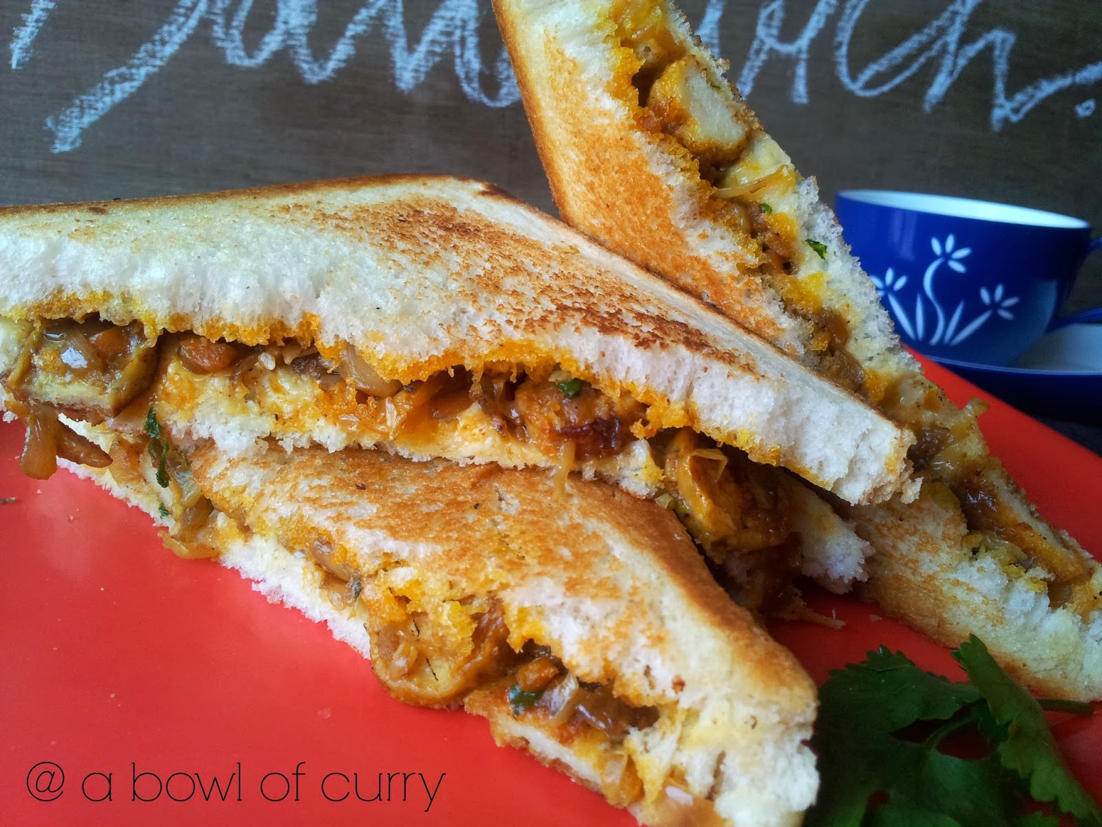 A Bowl Of Curry Chicken Sausage Sandwich