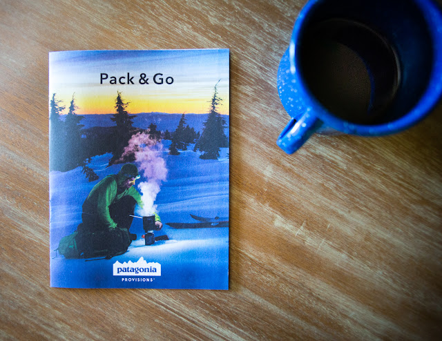 Professional snowboarder Josh Dirksen cooks on the cover of the Patagonia Provisions catalog. 