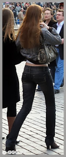 Slim girl in tight jeans on the street 