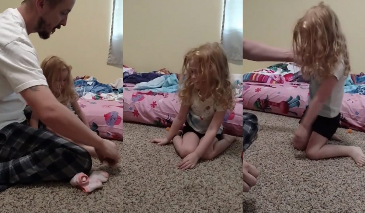 Daddy helps with daughters flexibility