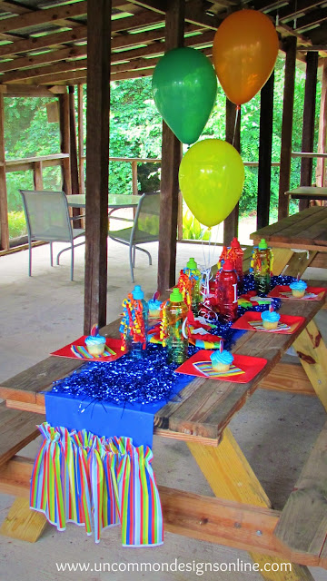 ruffled tablerunner from plastic tablecloths #partyideas #partydecor