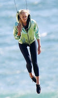 At the seashore in Cape Town, South Africa, the stunning brunette, Candice Swanepoel, 27, has been very busy to participate in the development of new advert on Saturday, December 19, 2015. The Supermodel flying and running in a green light jacket and black leggings.